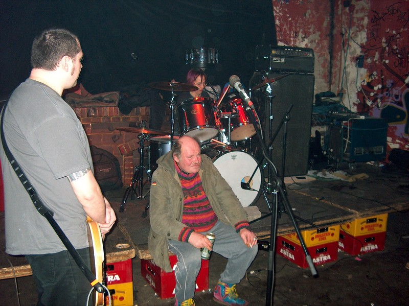 Drunk decided this was a good place to sit. Playing at the Rote Flora squat, Hamburg, Germany