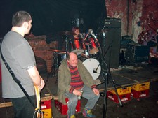 Drunk decided this was a good place to sit. Playing at the Rote Flora squat, Hamburg, Germany