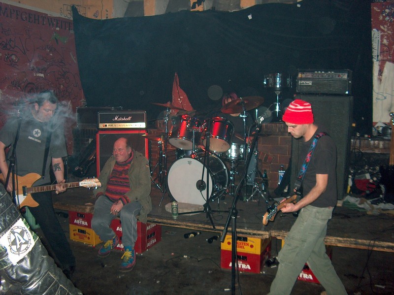 Drunk decided this was a good place to sit. Playing at the Rote Flora squat, Hamburg, Germany